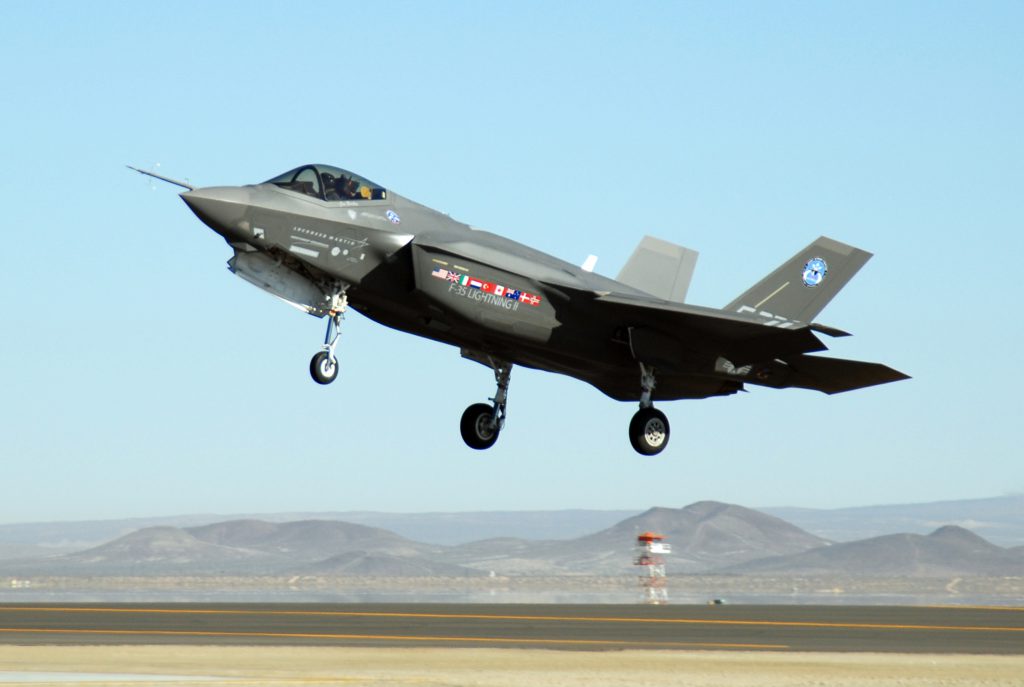 An F-35 Joint Strike Fighter, marked AA-1, lands Oct. 23 at Edwards Air Force Base, Calif. The F-35 Integrated Test Force staff concluded an air-start test. (U.S. Air Force photo/Senior Airman Julius Delos Reyes)