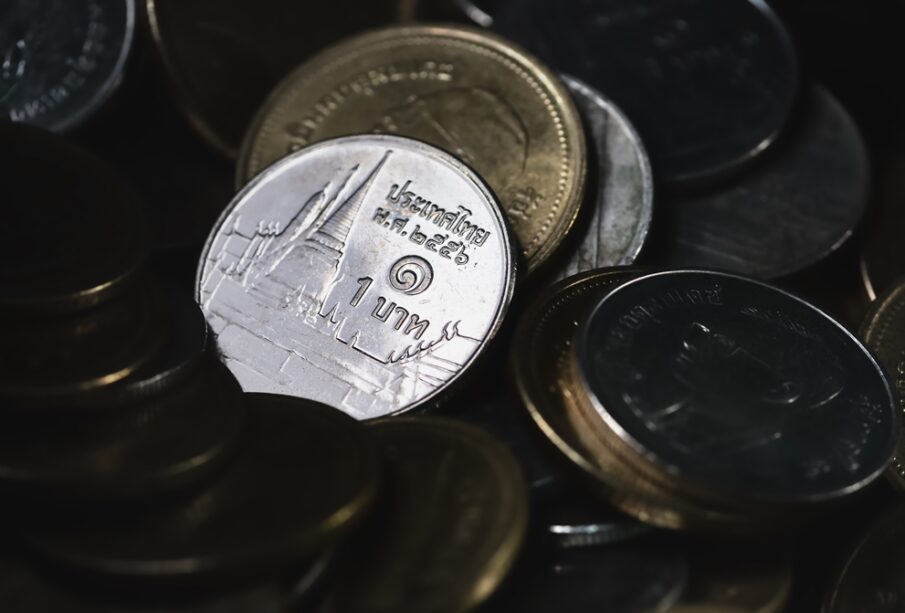 Macro shot of a large quantity of  Thai baht coins;Saving ,Finance and money exchange investment as concept.